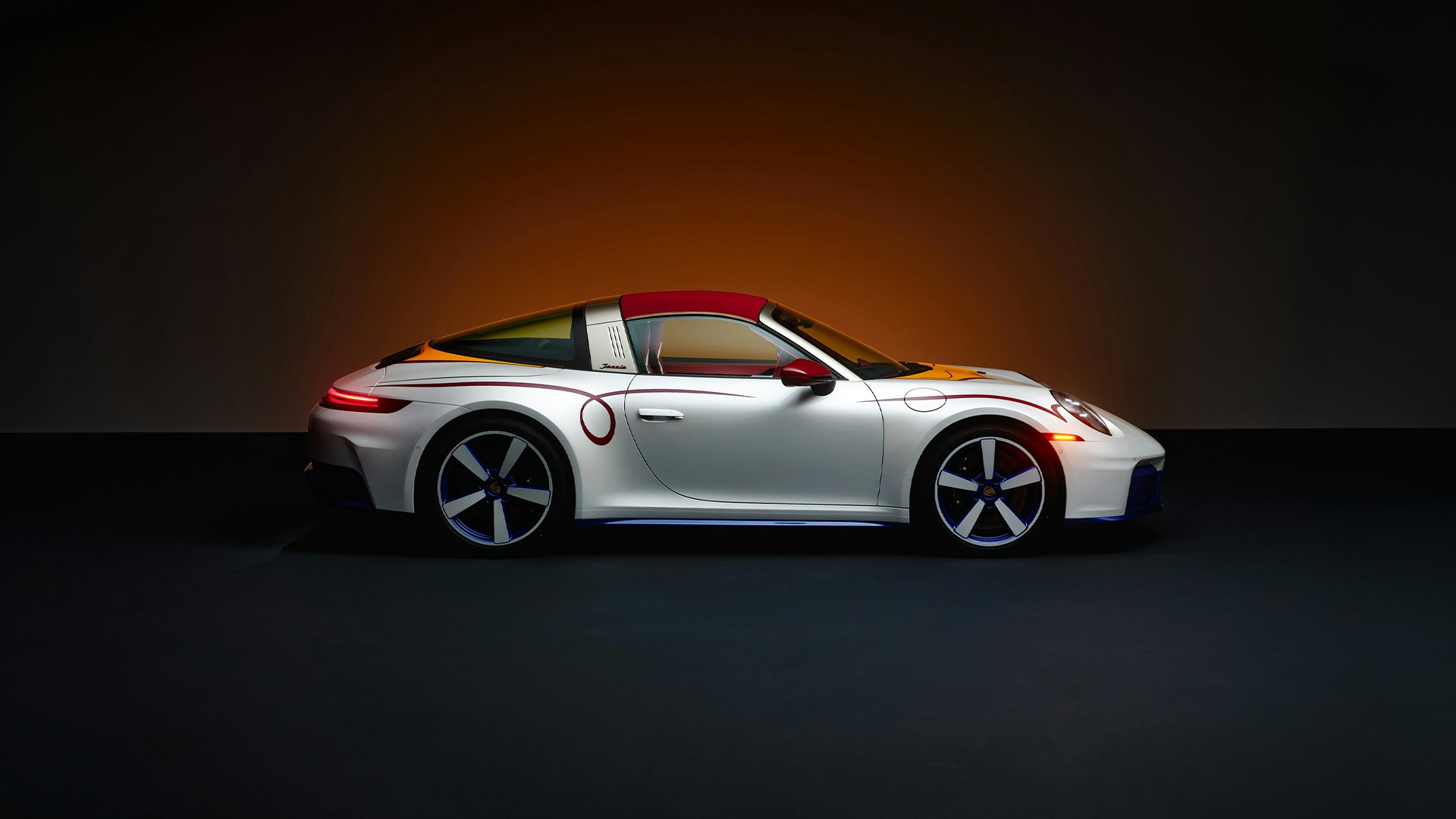Official Porsche photograph of the Jessie 911 Targa 4 GTS in side profile with its red roof